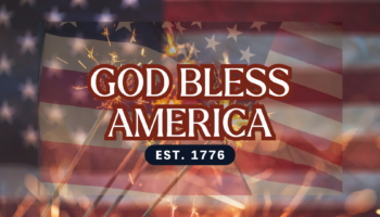 Patriotic banner with an American flag, sparklers, and the bold text 'GOD BLESS AMERICA' with 'EST. 1776'.